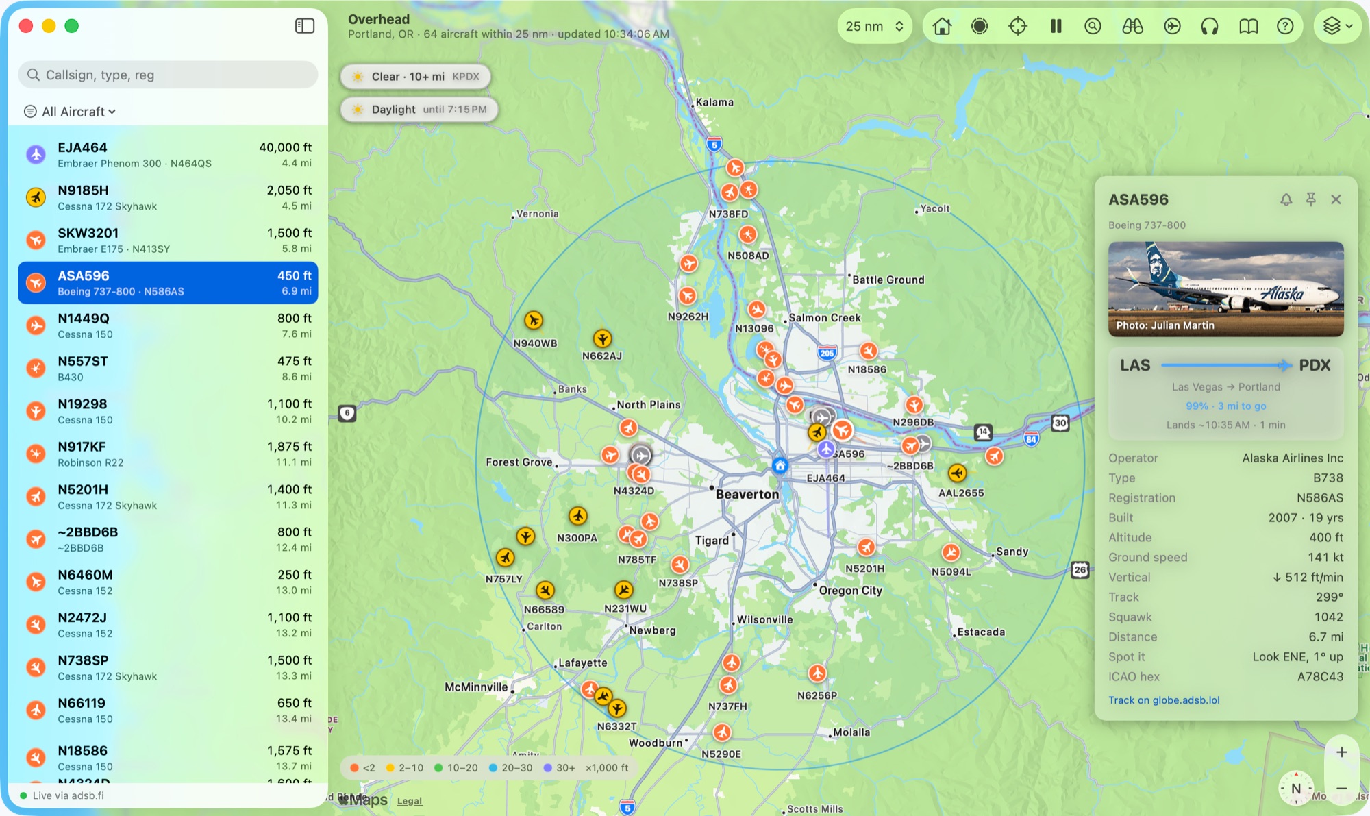 Overhead's window: flights in a sidebar, aircraft on a map coloured by altitude, a card for one.